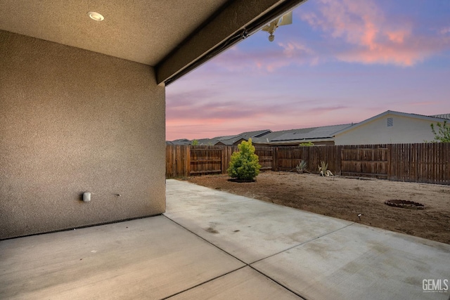 6622 Sycamore Wood Ln, Bakersfield, CA 93313 - patio terrace at dusk featuring a patio and a fenced backyard