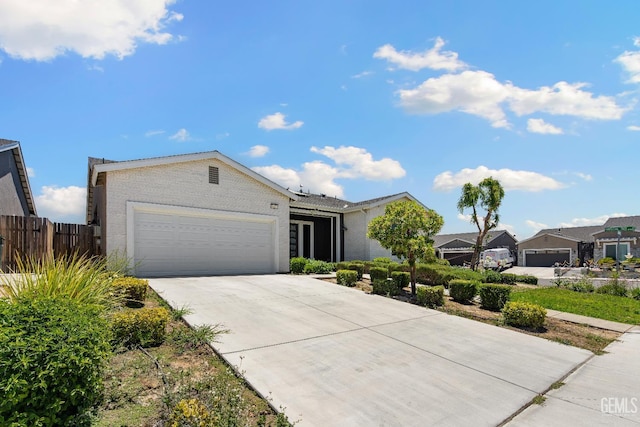 6622 Sycamore Wood Ln, Bakersfield, CA 93313 - view of front of house featuring concrete driveway and an attached garage