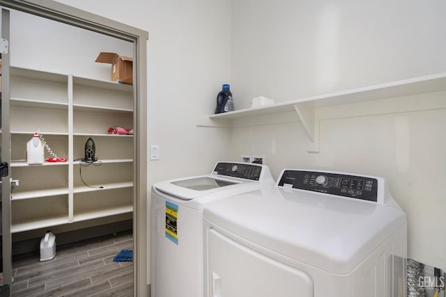 6622 Sycamore Wood Ln, Bakersfield, CA 93313 - washroom featuring washing machine and clothes dryer and wood finished floors