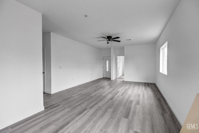 1627 Tejon St, Bakersfield, CA 93305 - empty room featuring wood finished floors, a ceiling fan, and baseboards