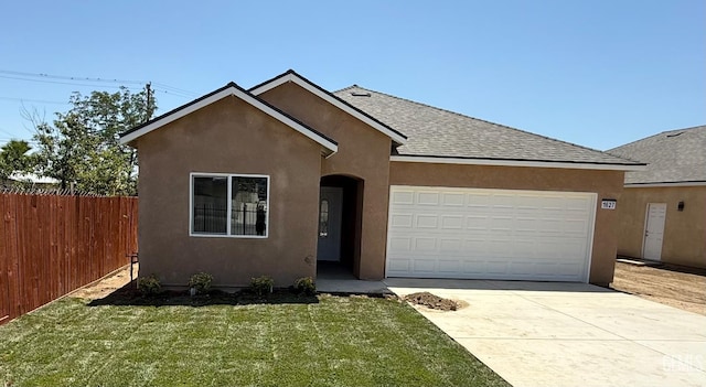 1627 Tejon St, Bakersfield, CA 93305 - view of front of property with stucco siding, concrete driveway, an attached garage, and a shingled roof