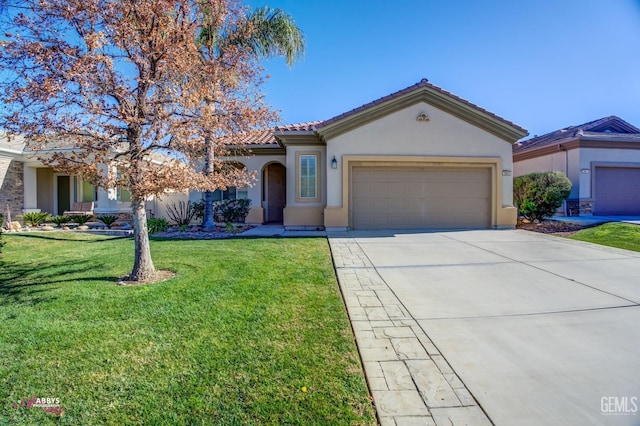 view of front of house featuring a garage and a front yard