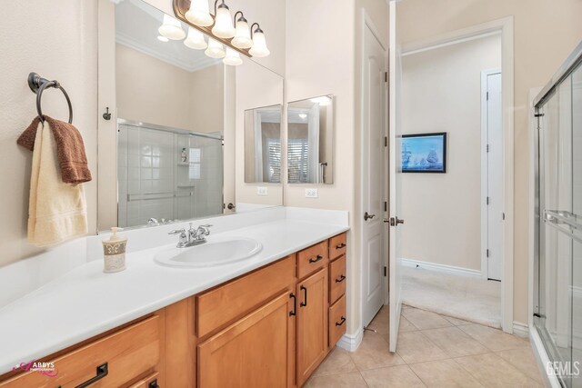 bathroom with tile patterned flooring, ornamental molding, separate shower and tub, and vanity