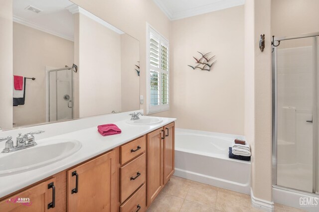 hall featuring crown molding and light tile patterned floors