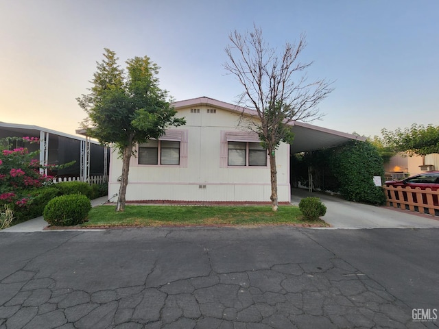 200 5th Ave Unit 32, Arvin, CA 93203 - manufactured / mobile home with an attached carport and asphalt driveway