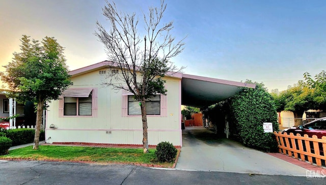 200 5th Ave Unit 32, Arvin, CA 93203 - view of front of house with a carport and driveway