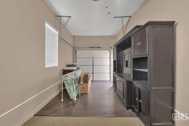garage featuring baseboards