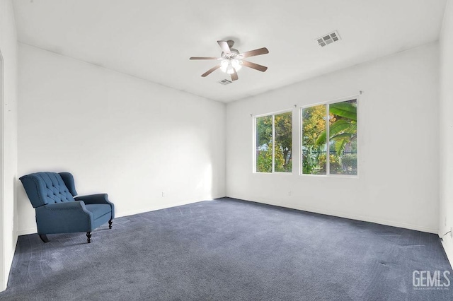 unfurnished room with baseboards, carpet, a ceiling fan, and visible vents