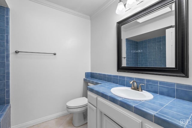 bathroom with vanity, a tile shower, ornamental molding, tile patterned flooring, and toilet