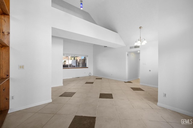 interior space featuring an inviting chandelier, visible vents, baseboards, and high vaulted ceiling