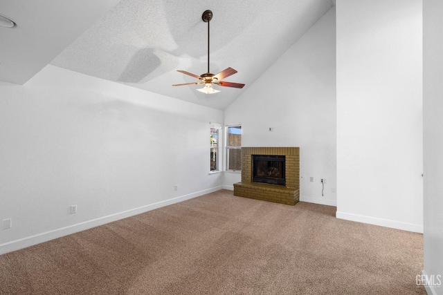 unfurnished living room with a ceiling fan, carpet, a fireplace, and baseboards