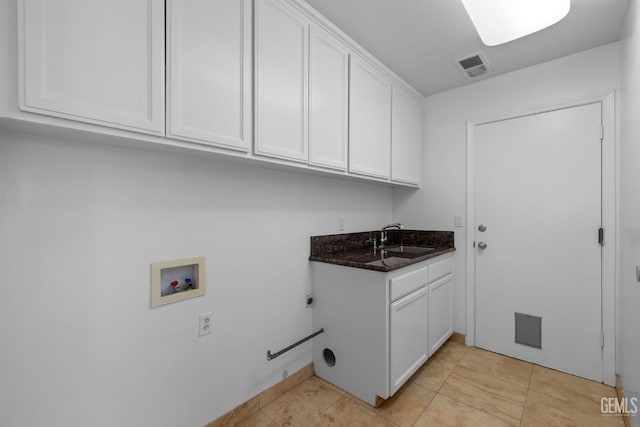 laundry room featuring visible vents, washer hookup, a sink, cabinet space, and light tile patterned floors