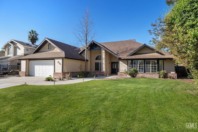 view of front of home with driveway, a front lawn, roof with shingles, an attached garage, and brick siding