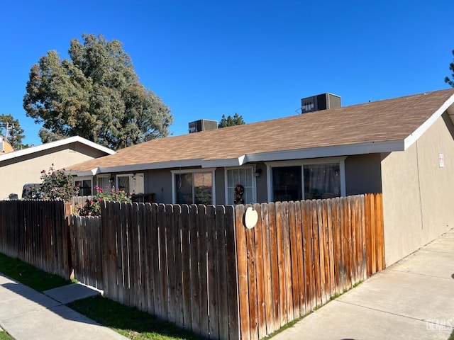 view of front of property featuring cooling unit