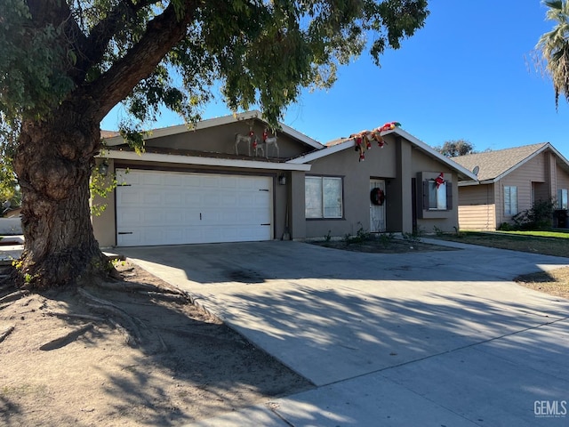 ranch-style house featuring a garage