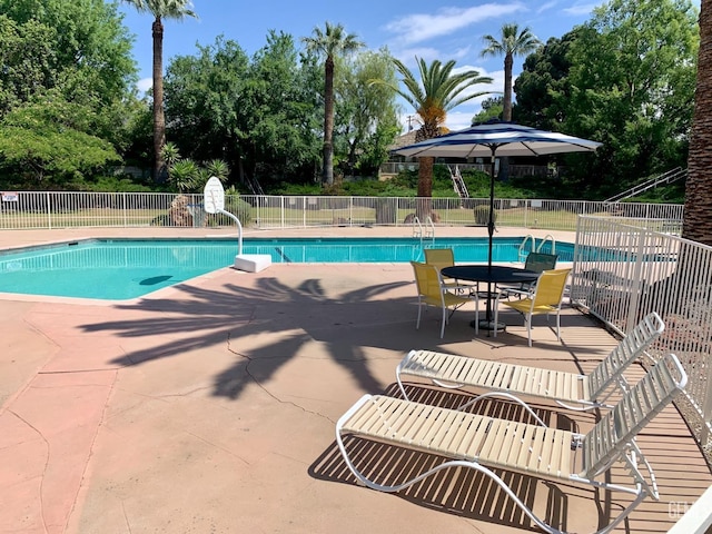 view of swimming pool featuring a patio area