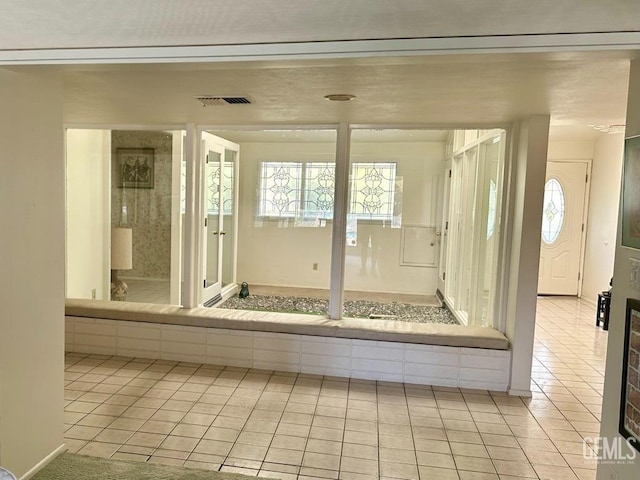 bathroom featuring tile patterned flooring