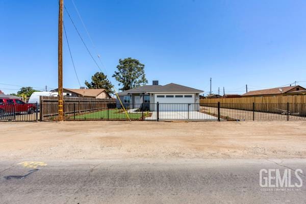 664 Fresno Ave, Shafter, CA 93263 - view of front of home with dirt driveway and a garage
