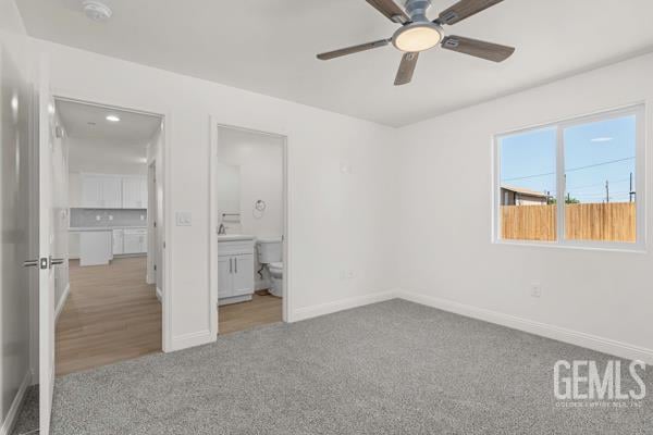 664 Fresno Ave, Shafter, CA 93263 - unfurnished bedroom with carpet and connected bathroom