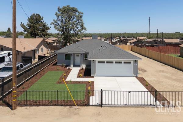 664 Fresno Ave, Shafter, CA 93263 - ranch-style home with a garage, driveway, and a residential view