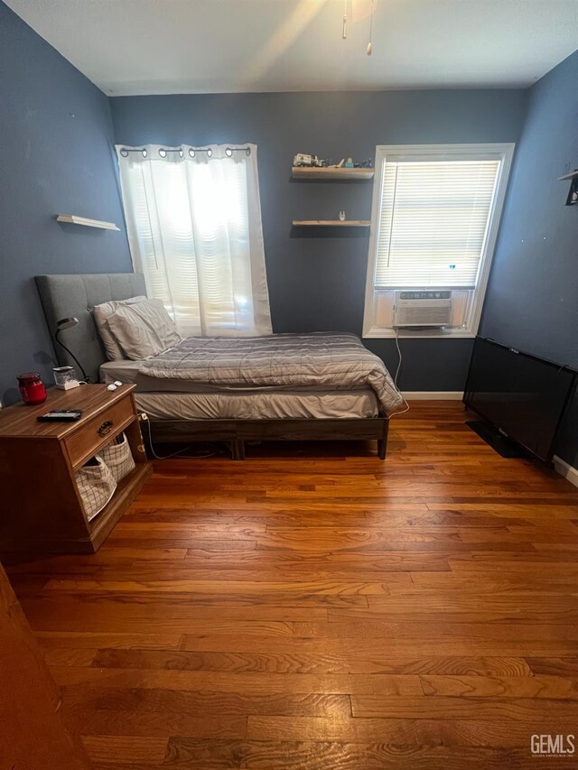 1405 Chester Ave, Bakersfield, CA 93301 - bedroom featuring cooling unit and wood finished floors