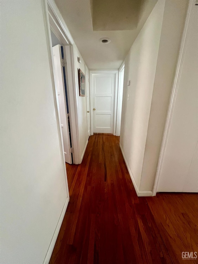 1405 Chester Ave, Bakersfield, CA 93301 - corridor with dark wood finished floors and baseboards