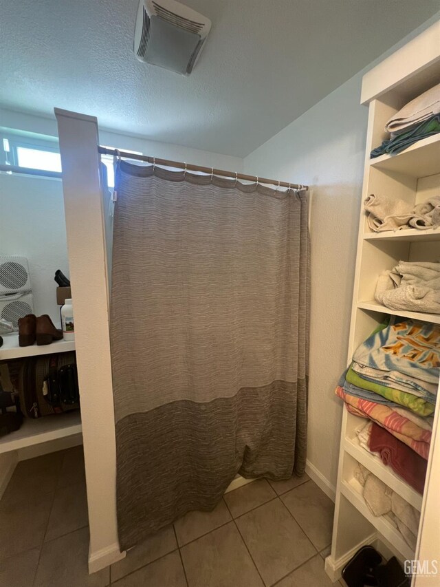 1405 Chester Ave, Bakersfield, CA 93301 - full bath featuring tile patterned floors and curtained shower