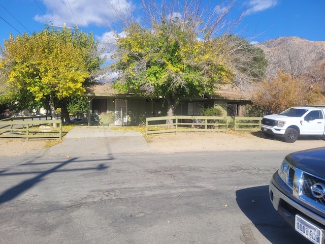 obstructed view of property with a mountain view