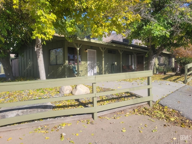 view of property exterior with a sunroom