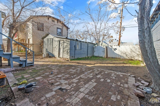 210 B B, Taft, CA 93268 - rear view of property with an outbuilding and a patio area