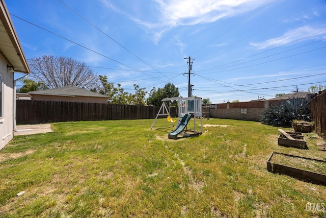 2805 Charleston Dr, Bakersfield, CA 93308 - view of yard featuring a fenced backyard and a playground