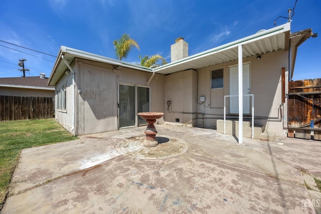 2805 Charleston Dr, Bakersfield, CA 93308 - back of house featuring a yard, a patio area, fence, and a chimney
