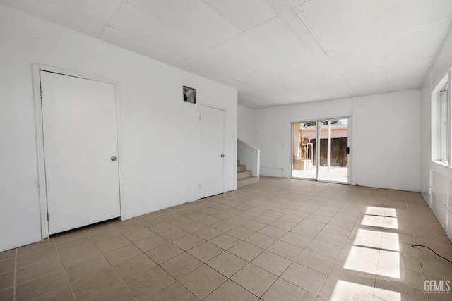 2805 Charleston Dr, Bakersfield, CA 93308 - spare room featuring stairway and light tile patterned floors