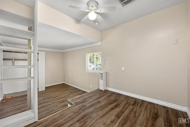 2805 Charleston Dr, Bakersfield, CA 93308 - unfurnished room with visible vents, baseboards, ceiling fan, crown molding, and wood finished floors