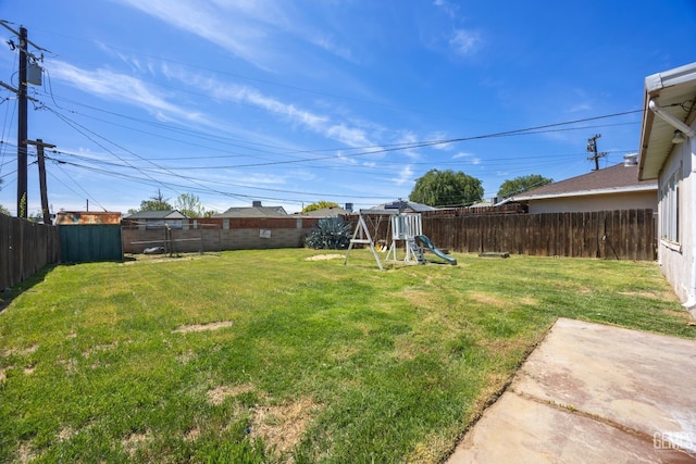 2805 Charleston Dr, Bakersfield, CA 93308 - view of yard featuring a fenced backyard and a playground