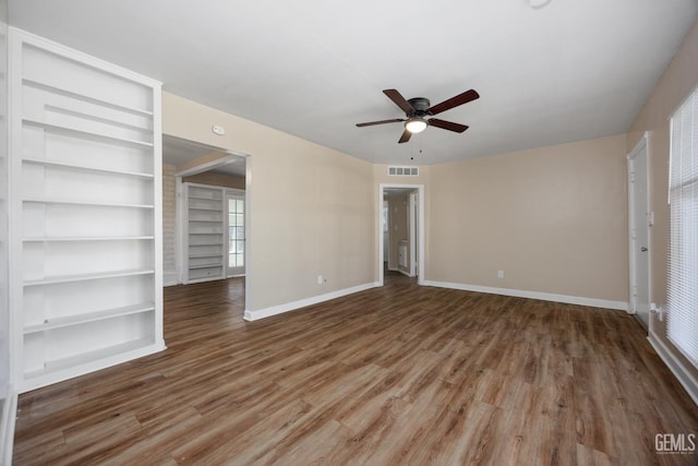 2805 Charleston Dr, Bakersfield, CA 93308 - unfurnished living room with wood finished floors, ceiling fan, baseboards, and visible vents