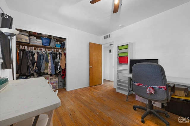 office space featuring hardwood / wood-style floors and ceiling fan