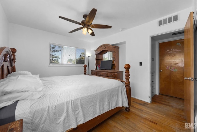 bedroom with hardwood / wood-style floors and ceiling fan