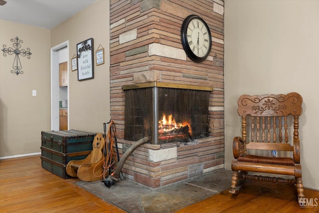 interior space with a fireplace and hardwood / wood-style flooring