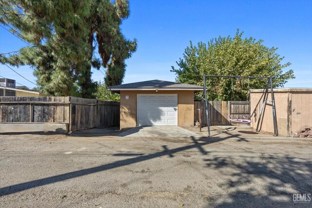 view of front of property with an outbuilding and a garage