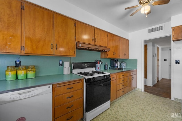 kitchen featuring white appliances, ventilation hood, and ceiling fan