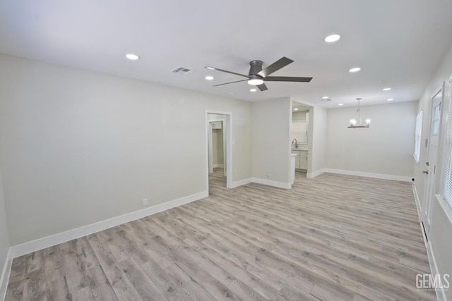 2408 Charleston Dr, Bakersfield, CA 93308 - unfurnished room with a chandelier, light wood finished floors, recessed lighting, and ceiling fan