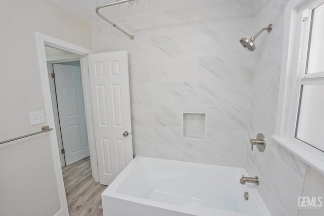 2408 Charleston Dr, Bakersfield, CA 93308 - full bathroom featuring washtub / shower combination and wood finished floors