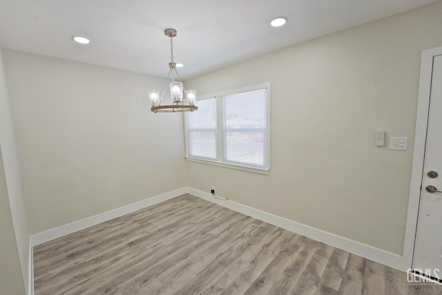2408 Charleston Dr, Bakersfield, CA 93308 - spare room with wood finished floors, a chandelier, and recessed lighting