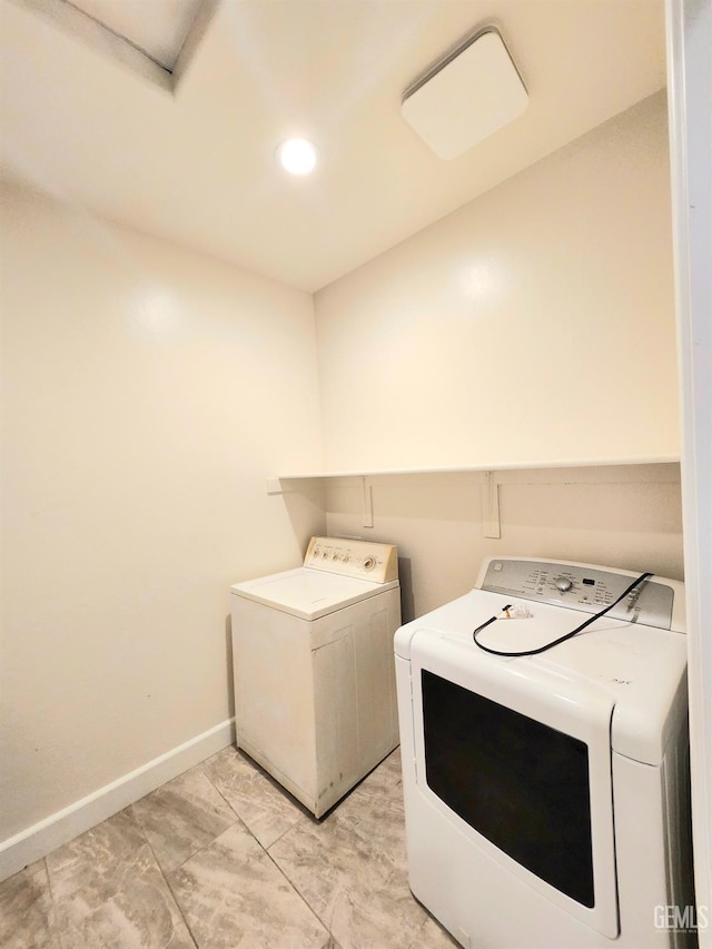 laundry area with separate washer and dryer