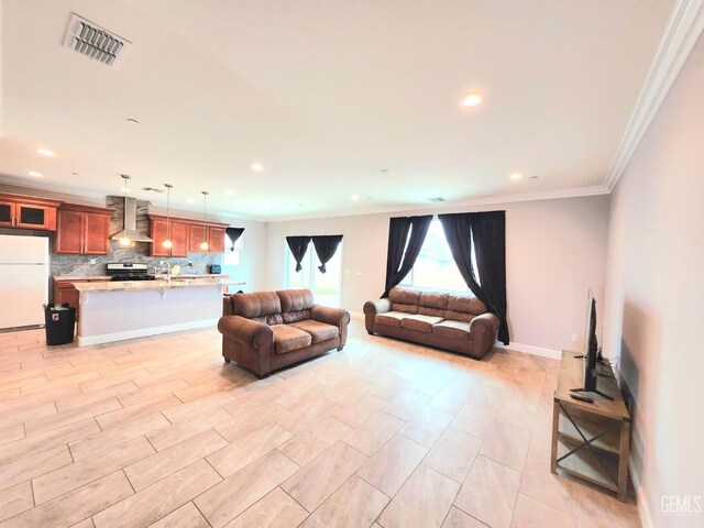 living room featuring crown molding