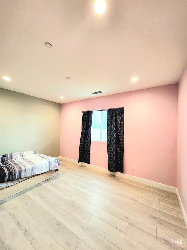 bedroom with light wood-type flooring