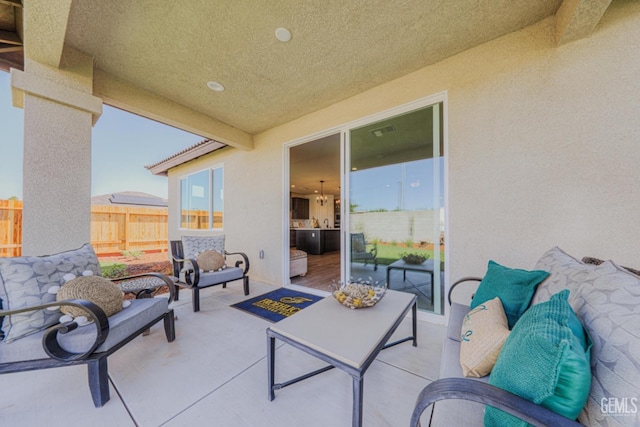 view of patio featuring fence