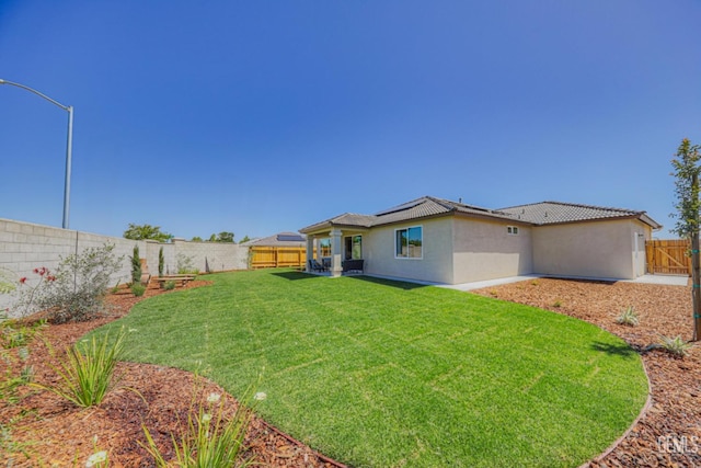 view of yard with a fenced backyard