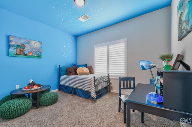 carpeted bedroom with visible vents and baseboards